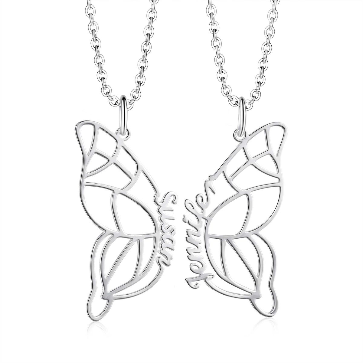 Gold personalized butterfly pendant necklace with delicate engraved wings resting on cream fabric