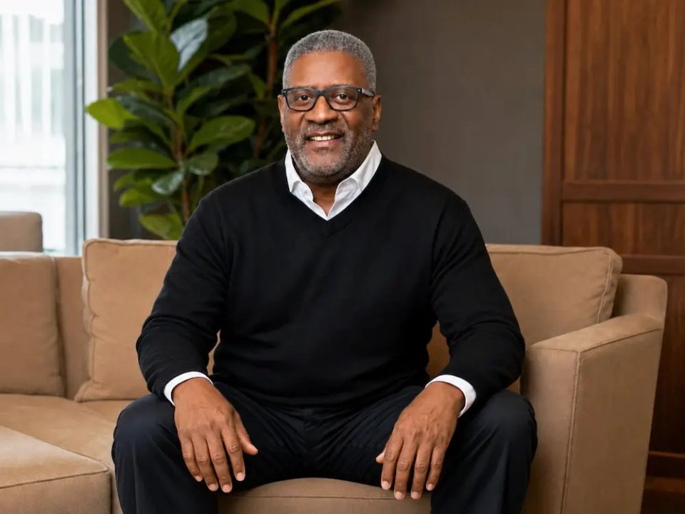 Andre Leftwich seated in a relaxed interview portrait