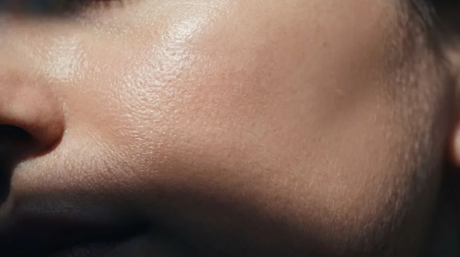 Macro close-up of healthy skin texture in cool directional light