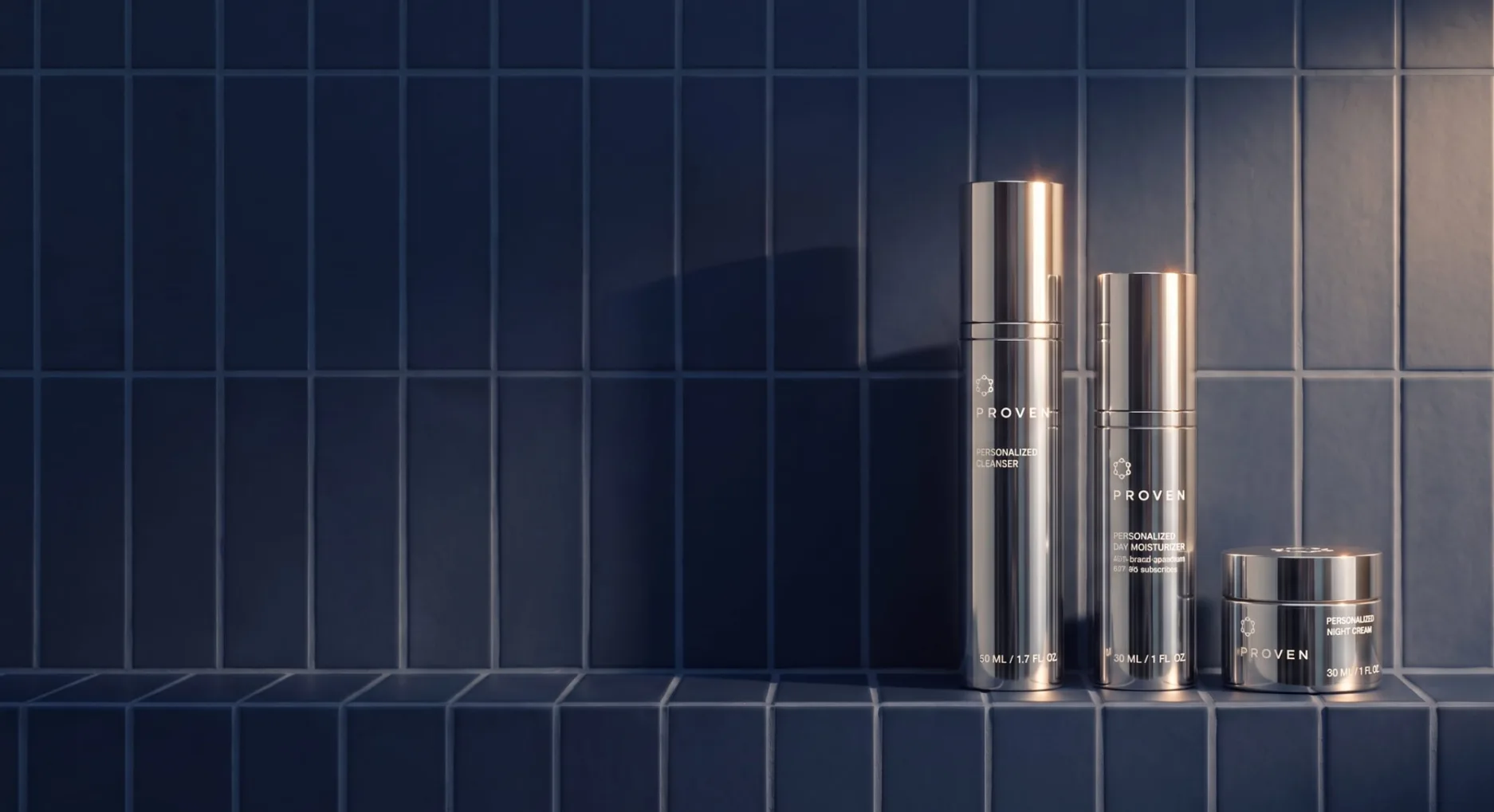 The PROVEN system — personalized cleanser, day moisturizer with SPF, and night cream on a dark blue tiled ledge
