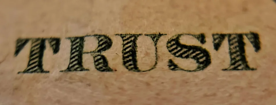 Dollar Bill Lettering "TRUST" Signifying strategies to choose a medical inventory software you can trust
