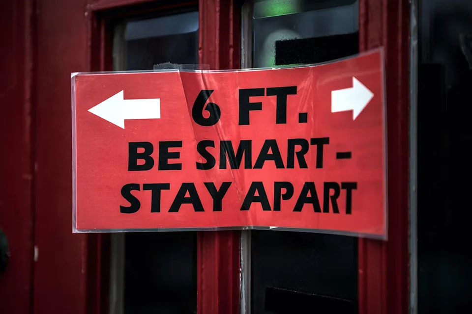 social distancing sign in red directing all to stay 6 ft apart - the new normal