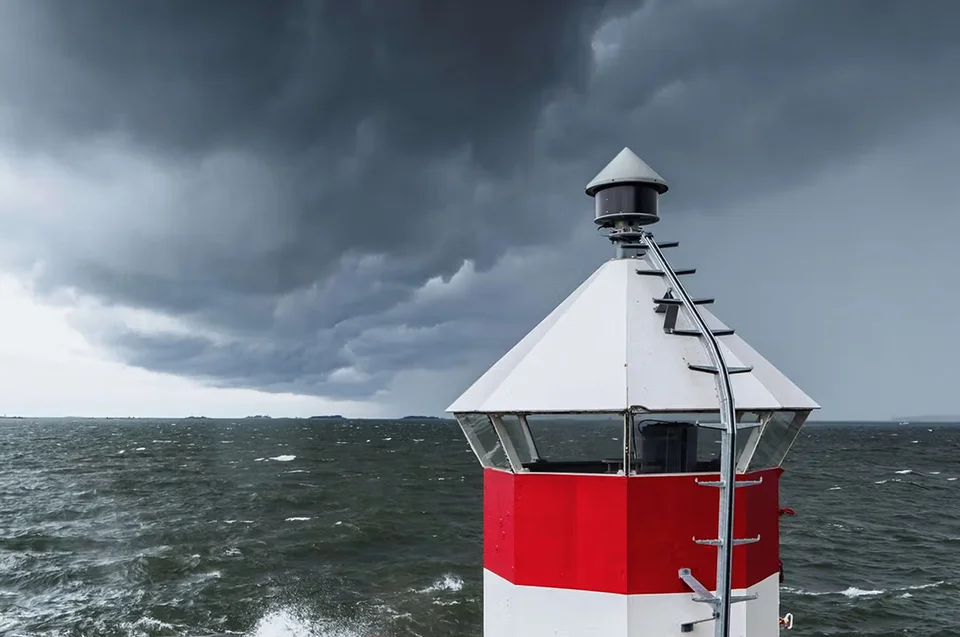 A storm approaching with a lighthouse in the foreground. Supply chain optimization and inventory visibility can act as a beacon in the face of supply chain disruption.