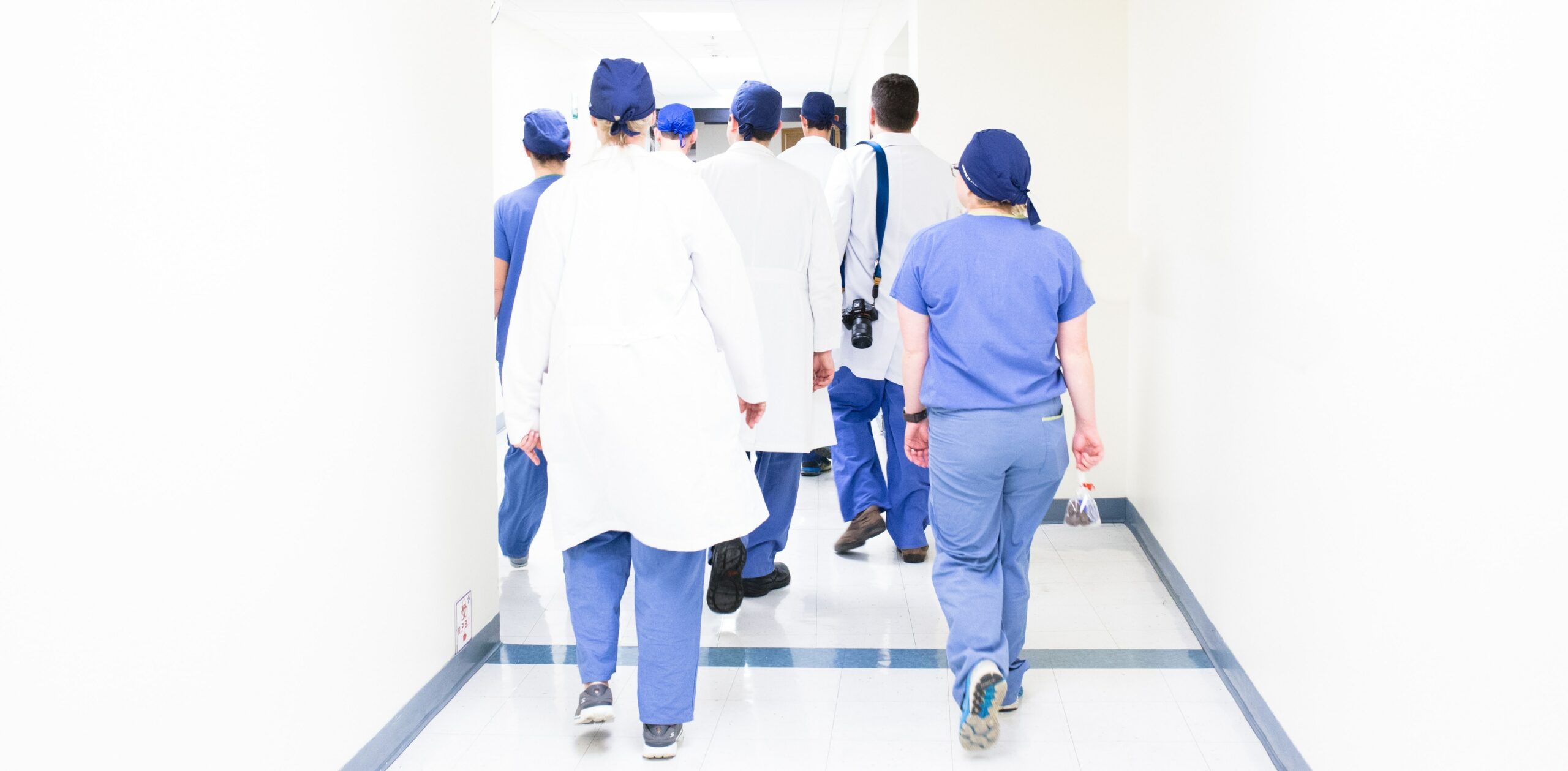 reps and surgeons walk down hospital corridor amid new pressures in the medical device industry