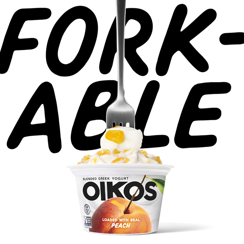 fork-able black type across the top with an oikos package under and a fork going into the yogurt