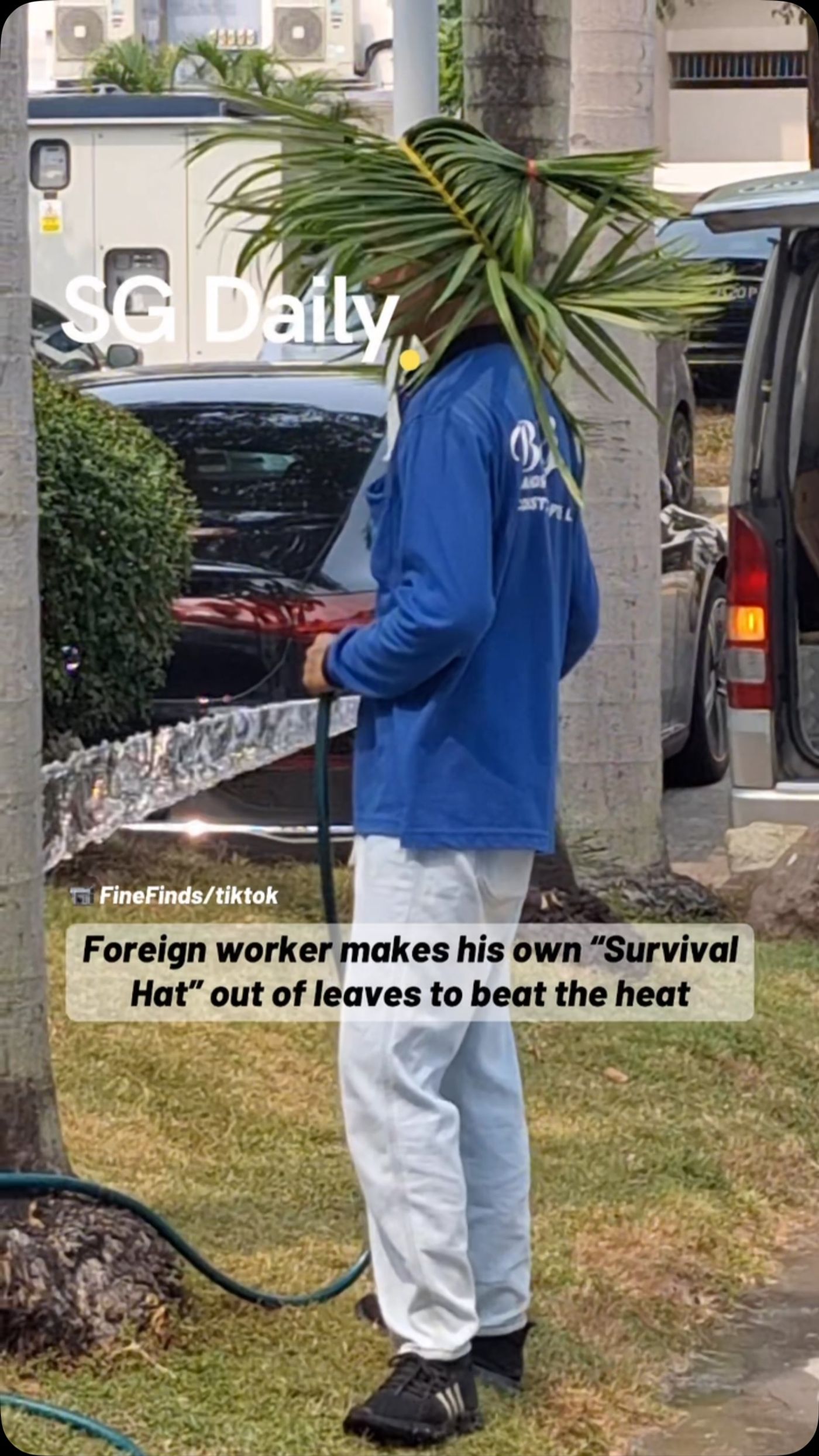 Foreign worker makes his own "Survival Hat" out of leaves to beat the heat