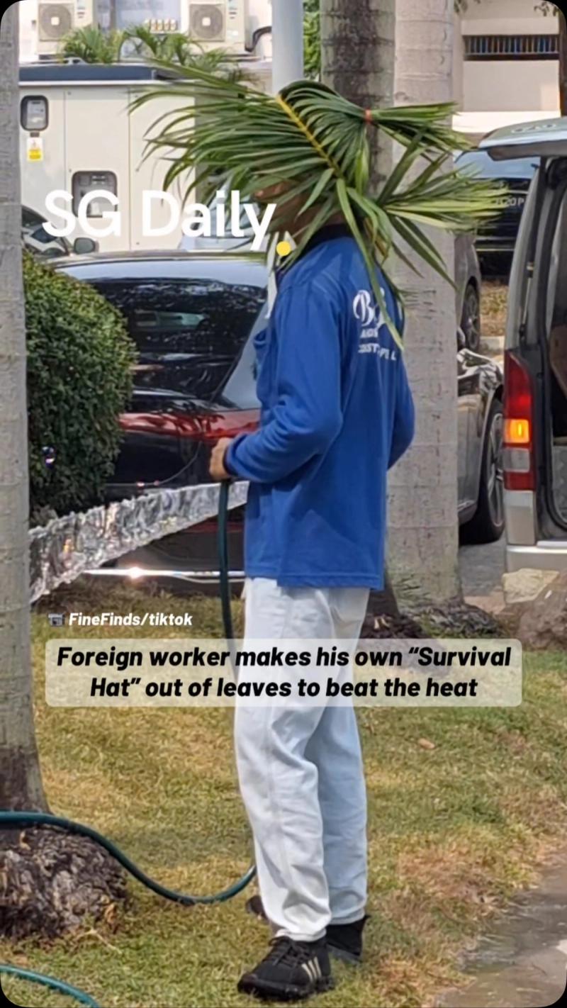 Foreign worker makes his own "Survival Hat" out of leaves to beat the heat