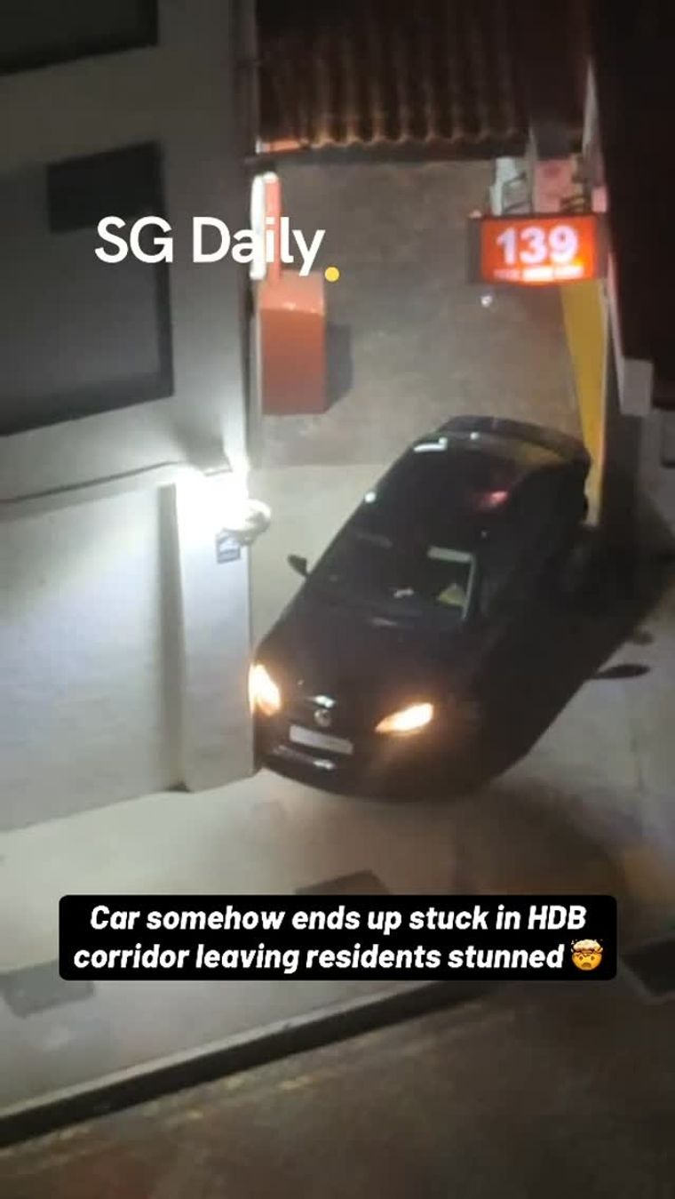Car somehow ends up stuck in HDB corridor leaving residents stunned