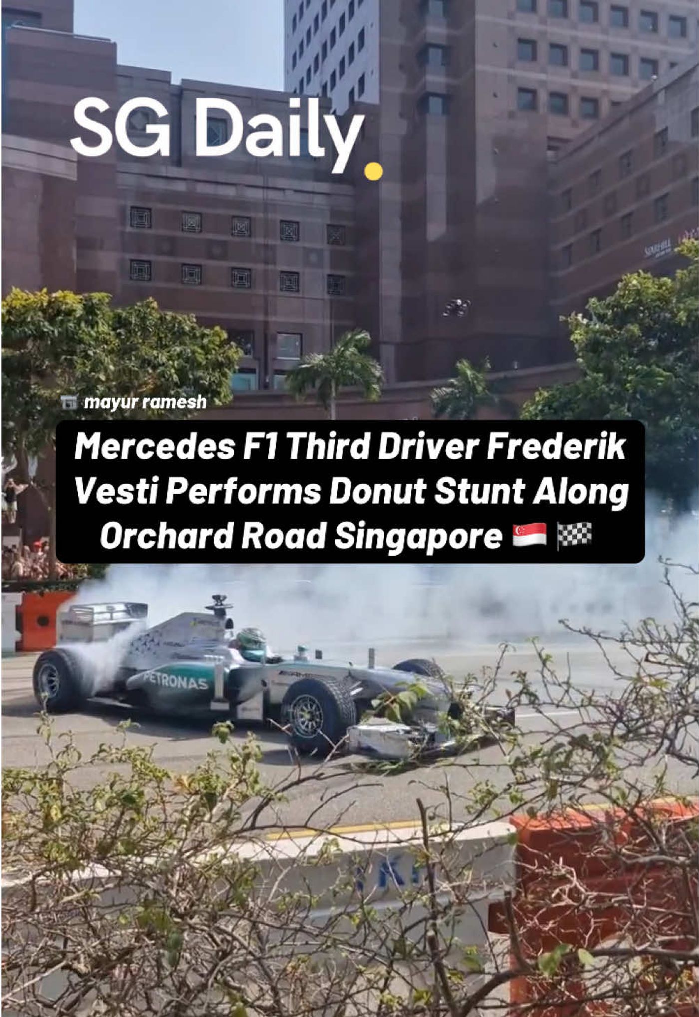 Mercedes F1 third driver Frederik Vesti performs donut stunt along Orchard Road