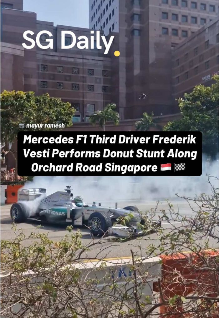 Mercedes F1 third driver Frederik Vesti performs donut stunt along Orchard Road