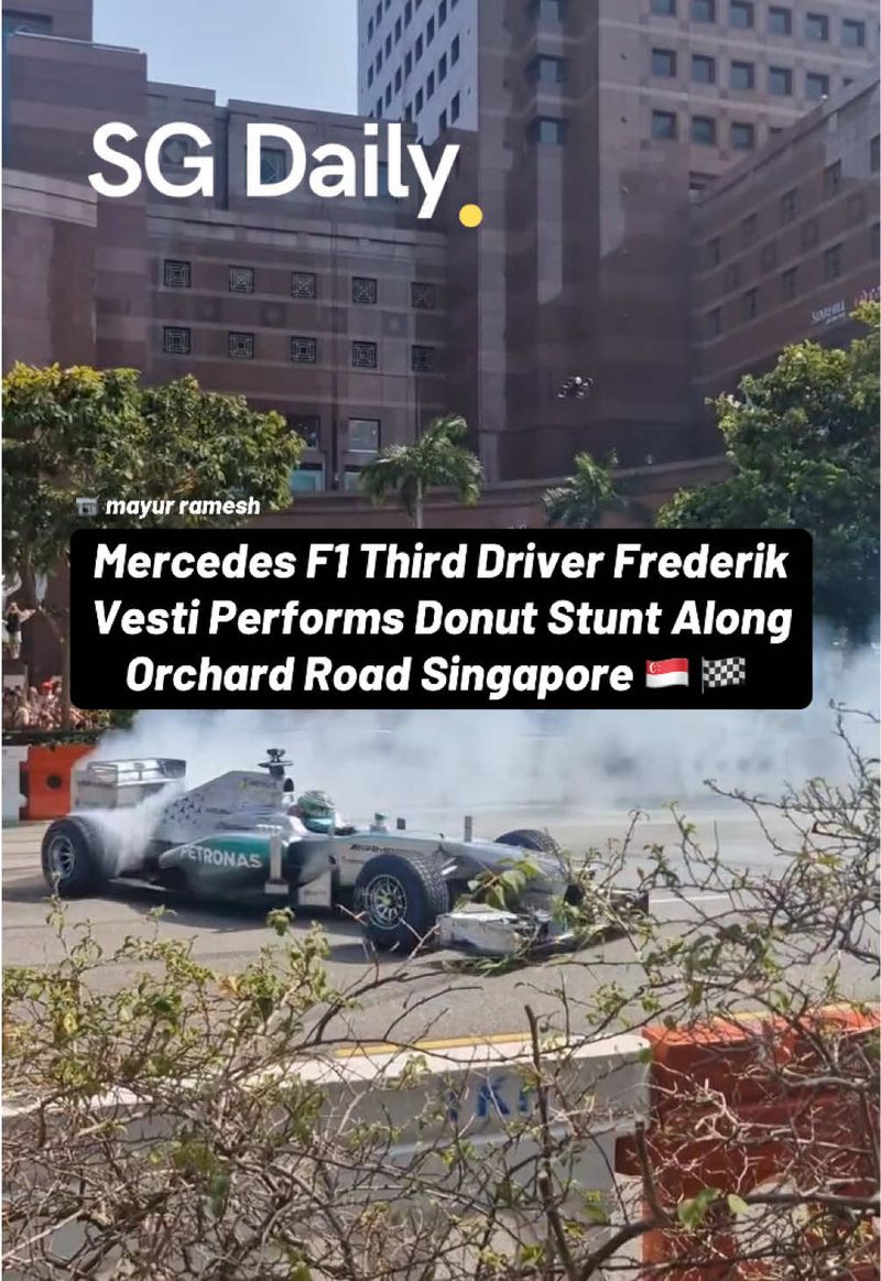Mercedes F1 third driver Frederik Vesti performs donut stunt along Orchard Road