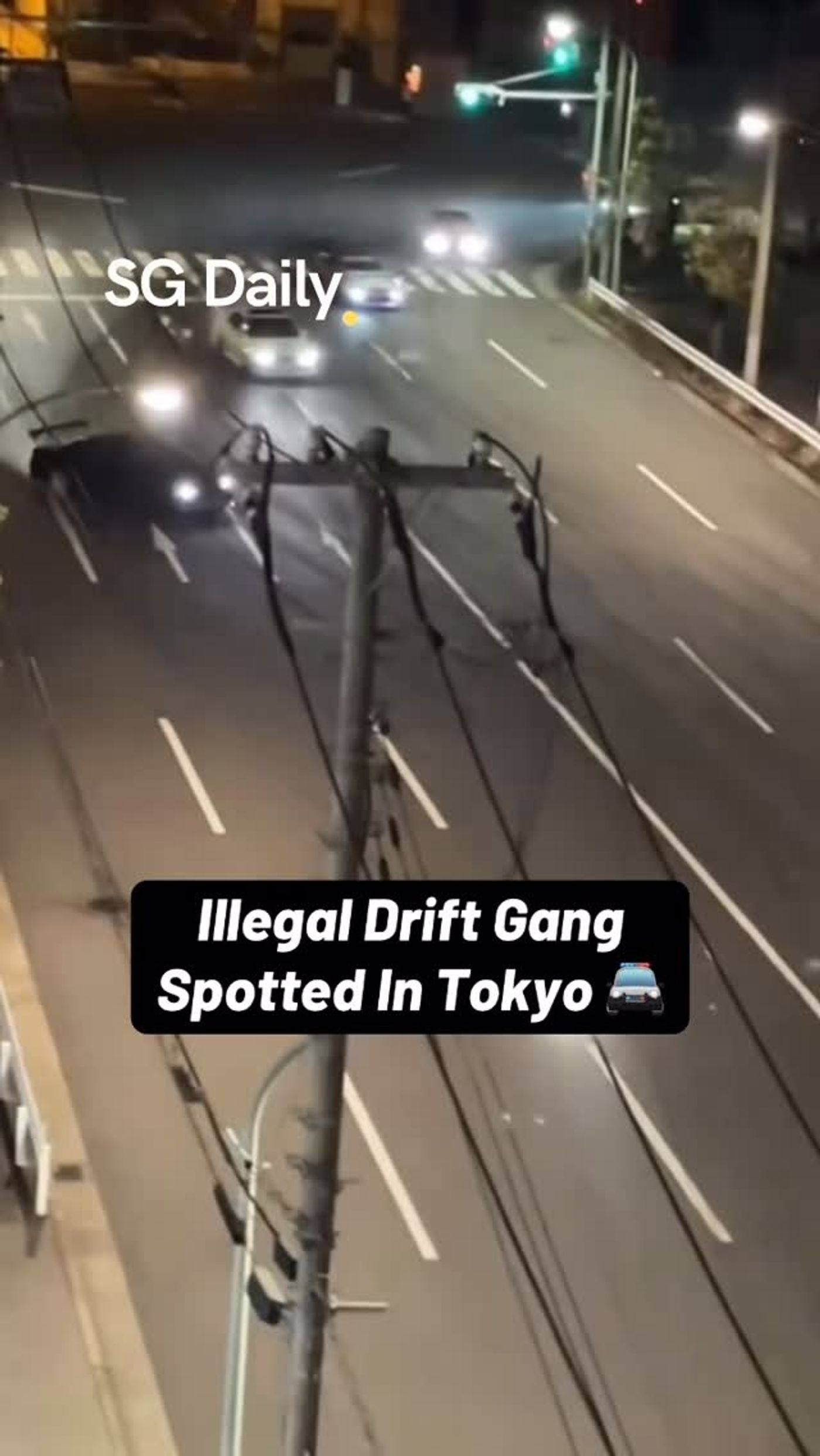 Cars seen drifting on Tokyo road at night