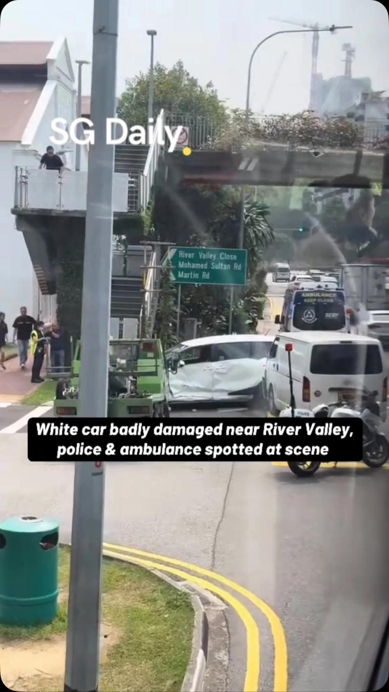 White car badly damaged near River Valley, police and ambulance spotted at scene