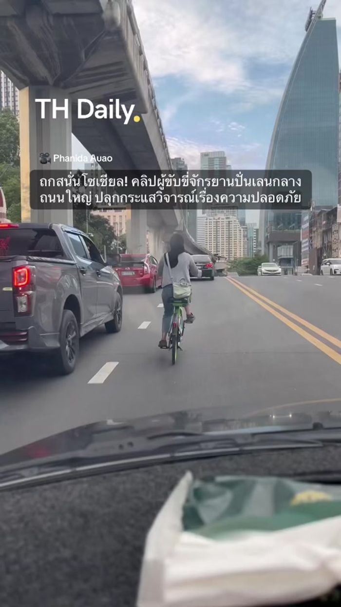 Cyclist filmed riding through heavy Bangkok traffic