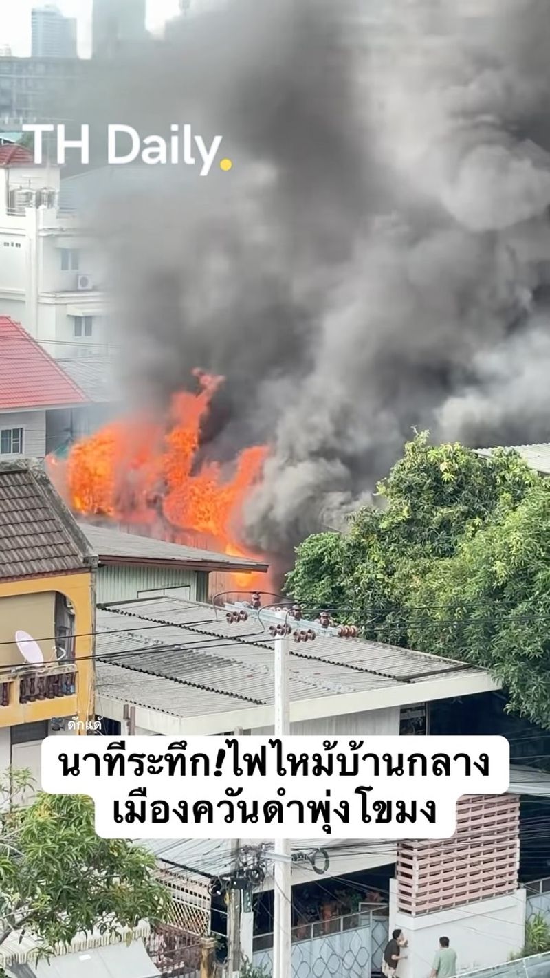 House fire sends black smoke above nearby buildings