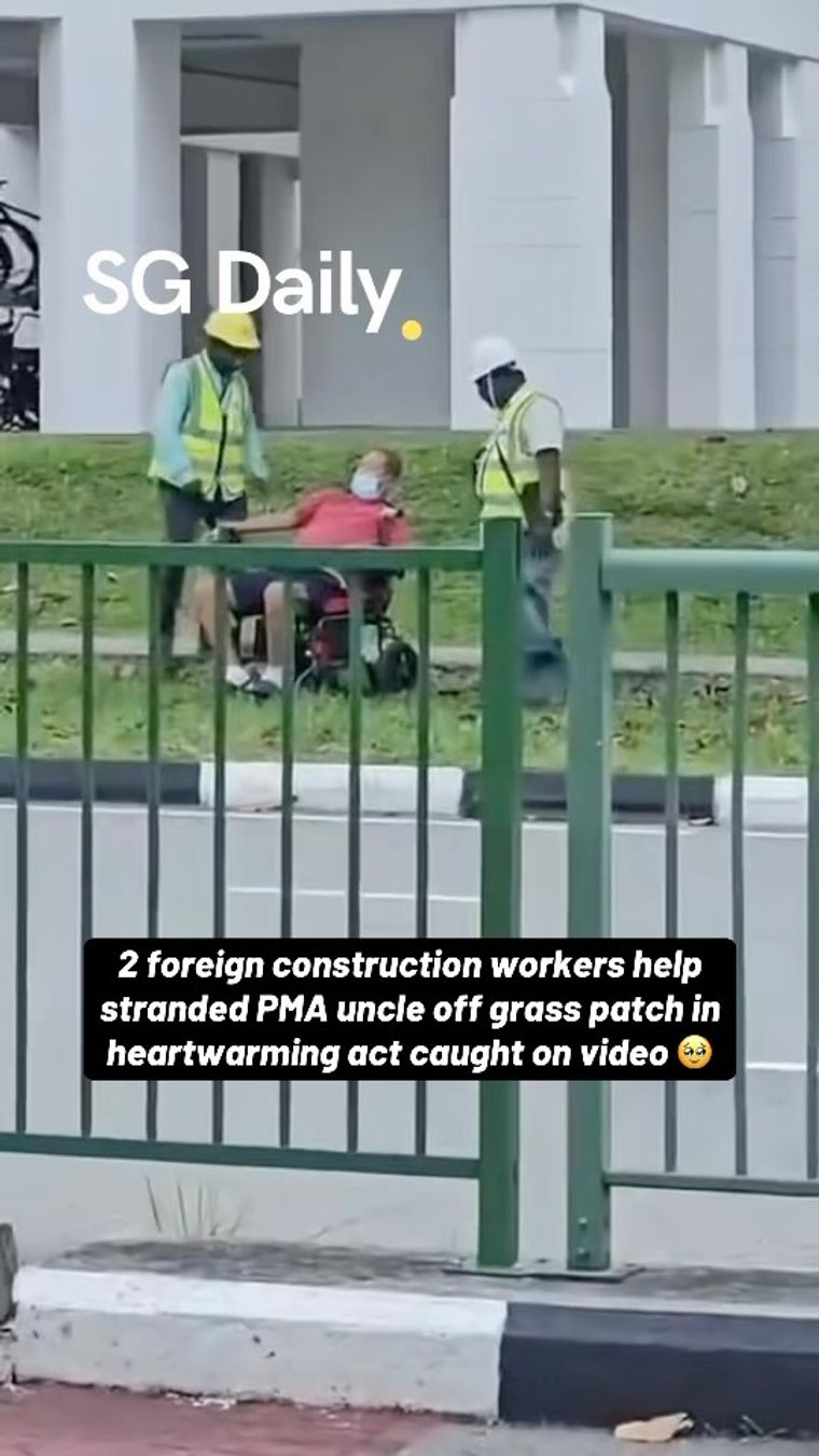 2 foreign construction workers help stranded PMA uncle off grass patch