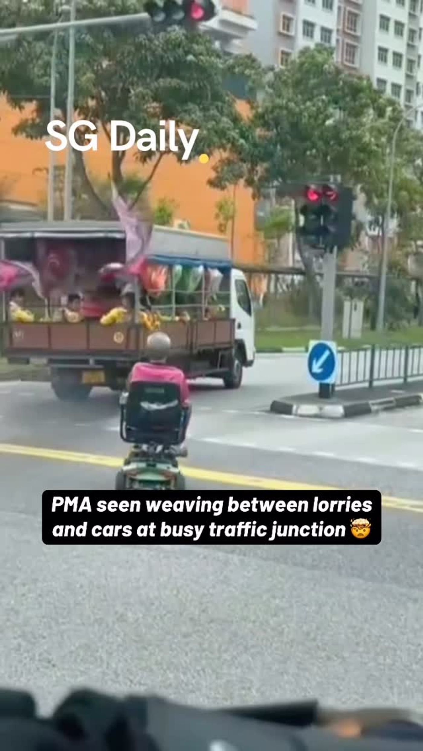 PMA seen weaving between lorries and cars at busy traffic junction