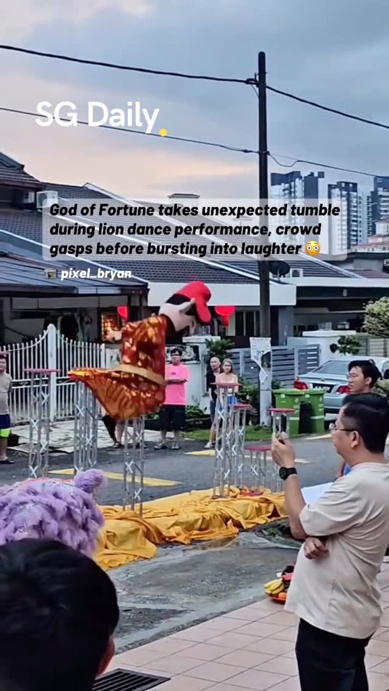 God of Fortune takes unexpected tumble during lion dance performance