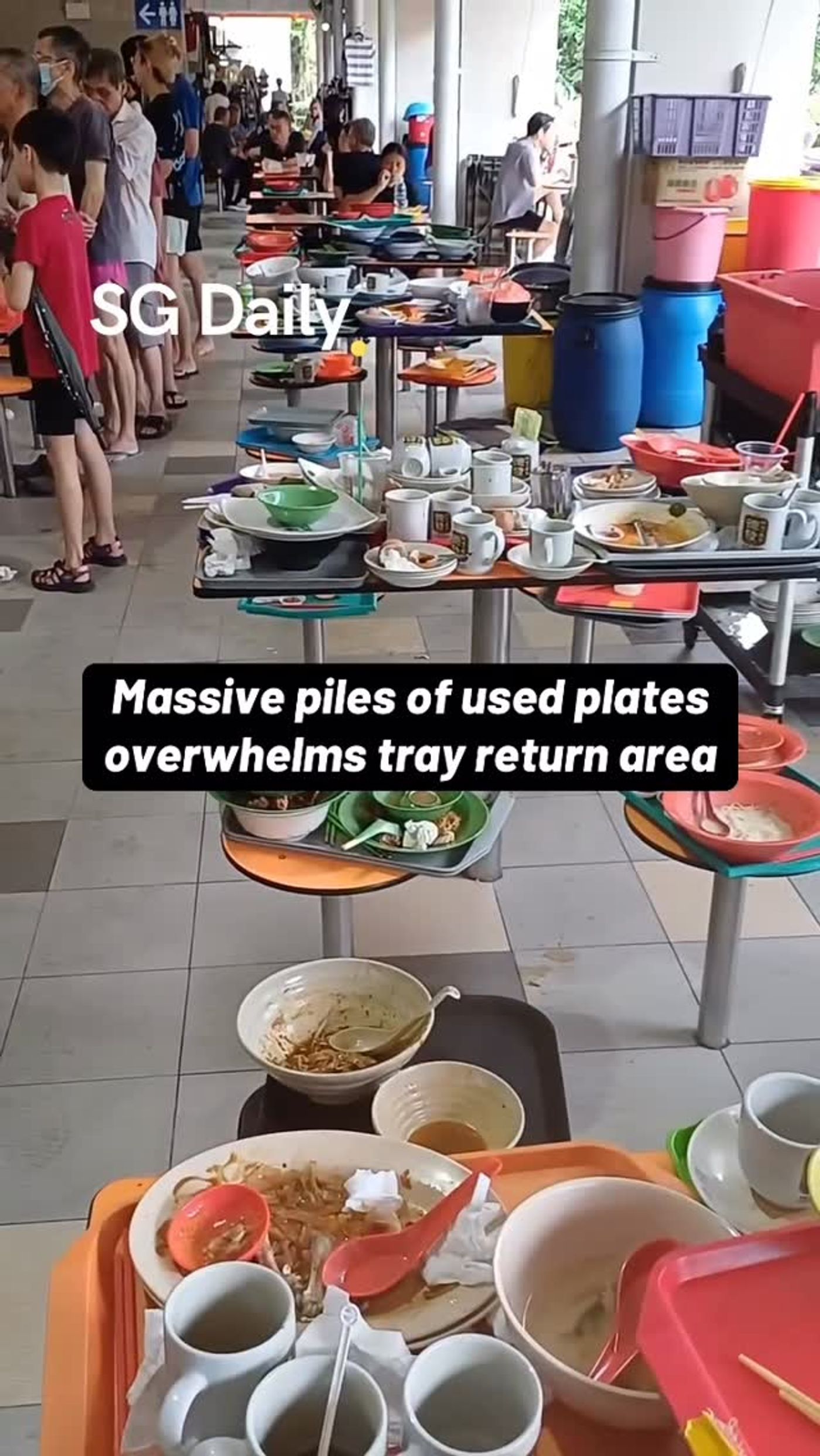 Massive piles of used plates overwhelms tray return area