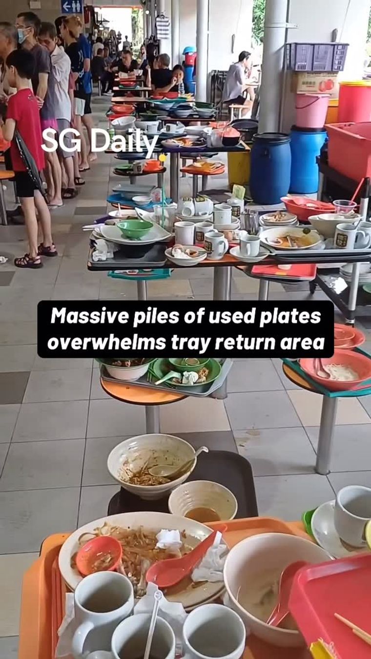 Massive piles of used plates overwhelms tray return area