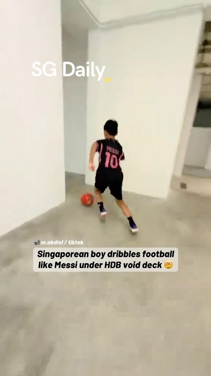 Singaporean boy dribbles football like Messi under HDB void deck