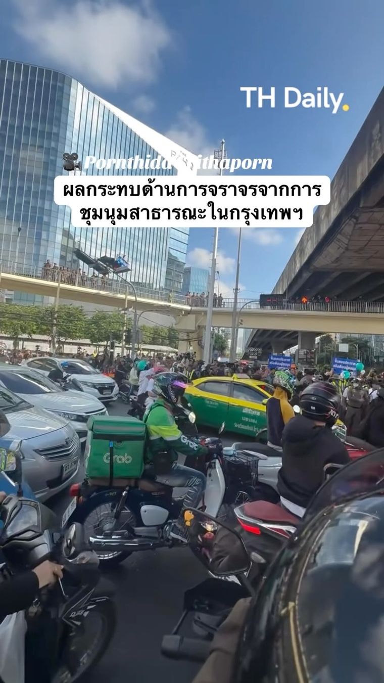 Traffic queues beside public gathering in Bangkok