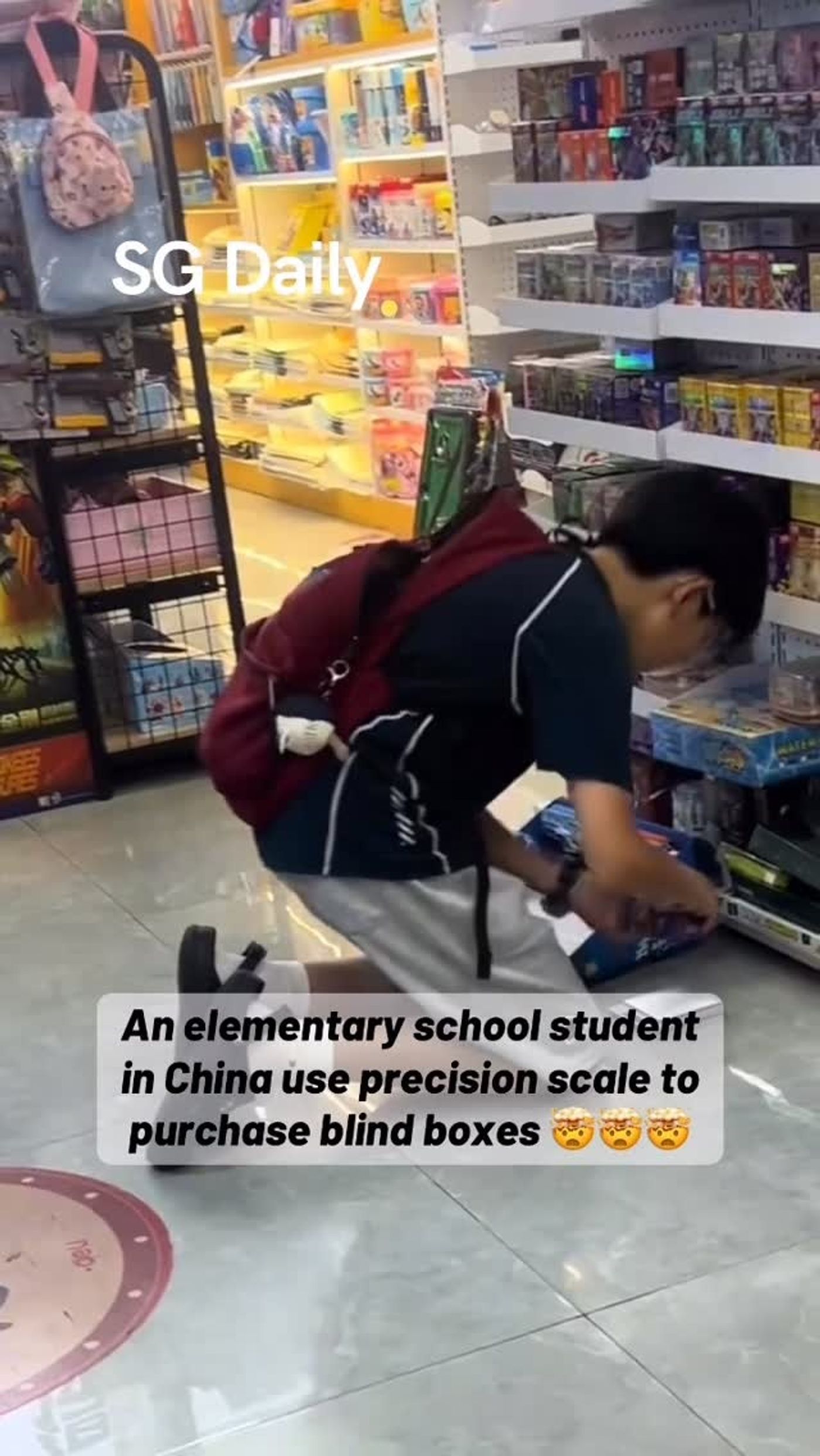 An elementary school student in China use precision scale to purchase blind boxes