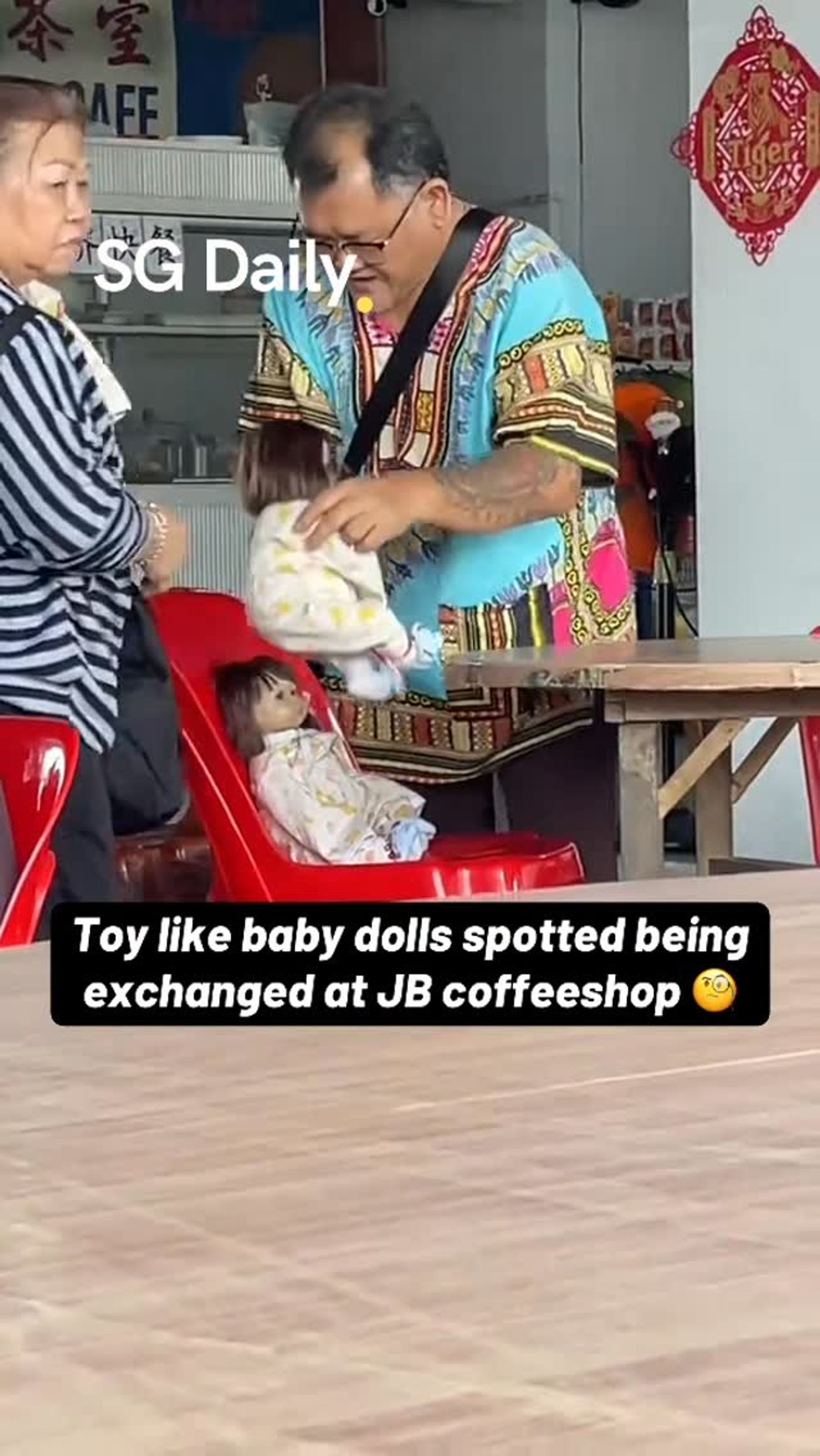 Toy-like baby dolls spotted being exchanged at JB coffeeshop