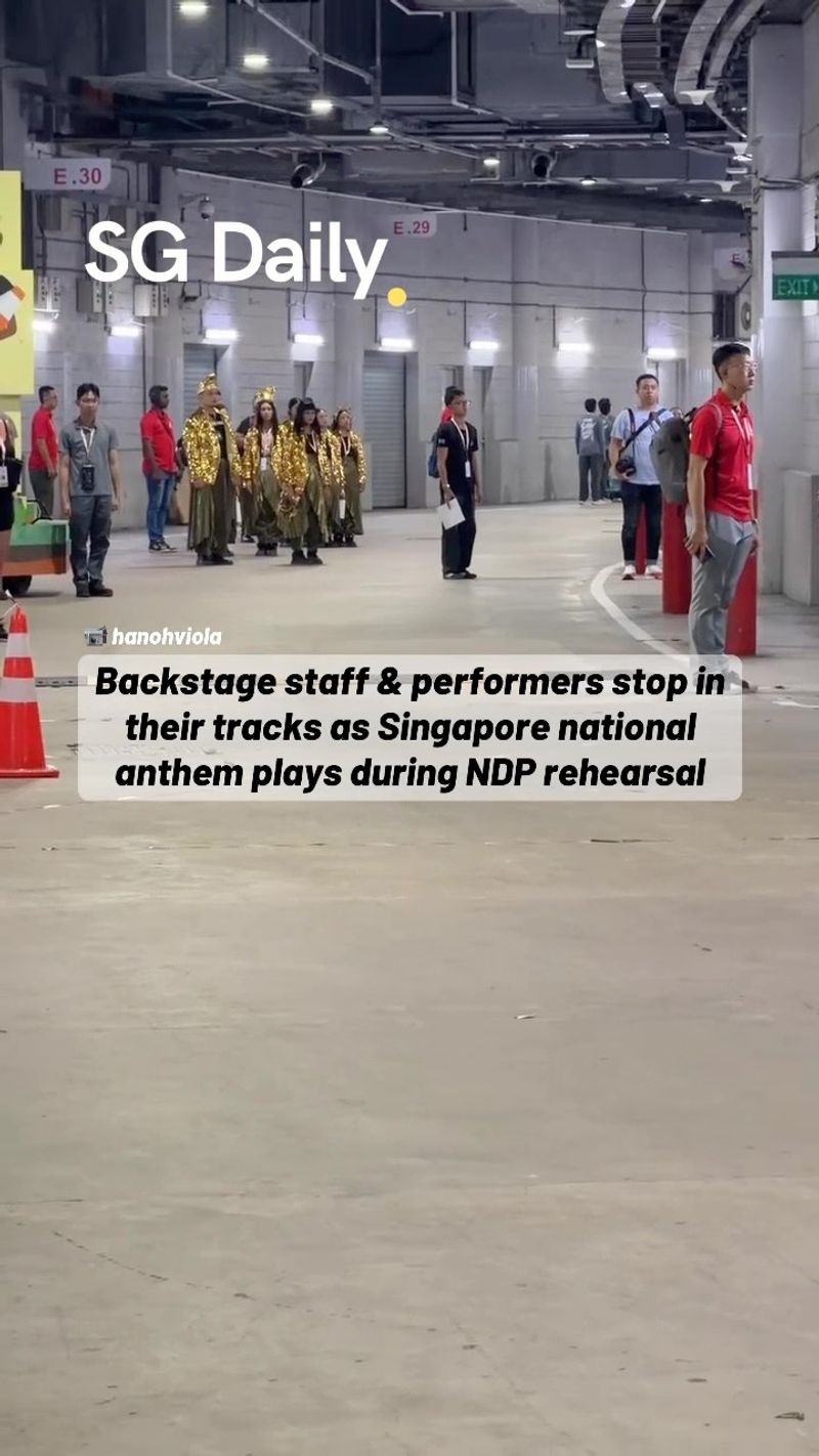 Backstage staff and performers stop in their tracks as Singapore national anthem plays during NDP rehearsal