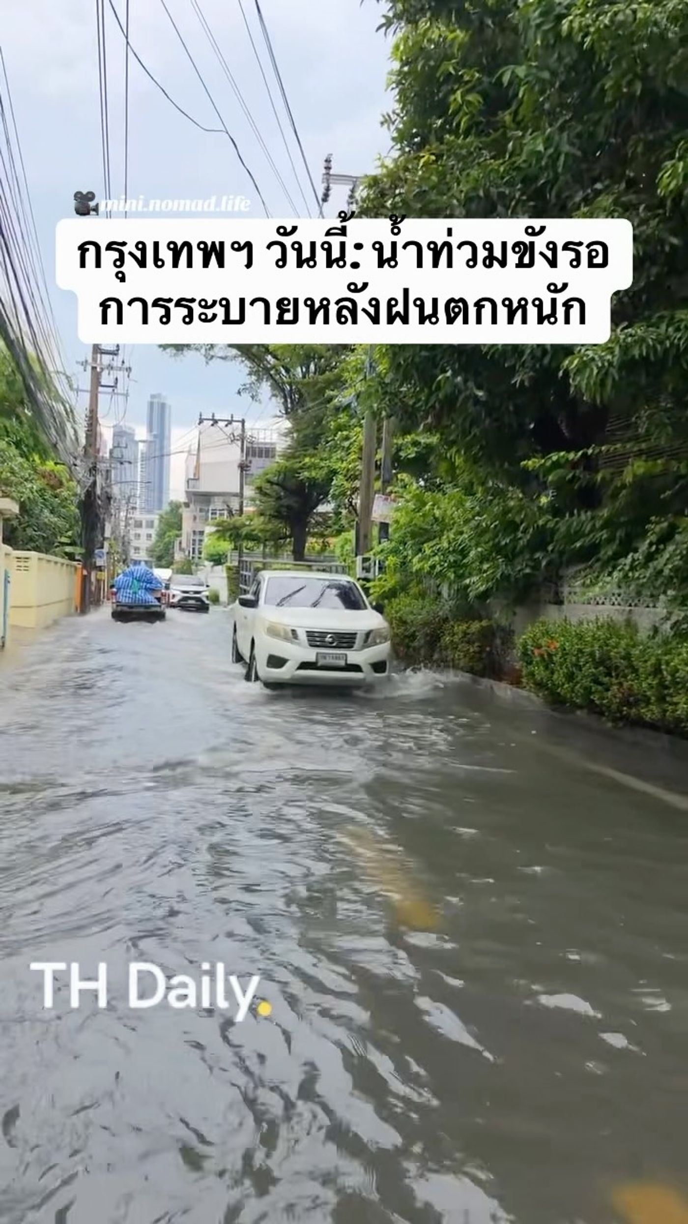 Bangkok road remains flooded after heavy rain
