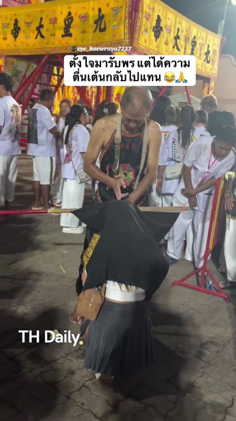 Worshipper gets an unexpected blessing at a shrine