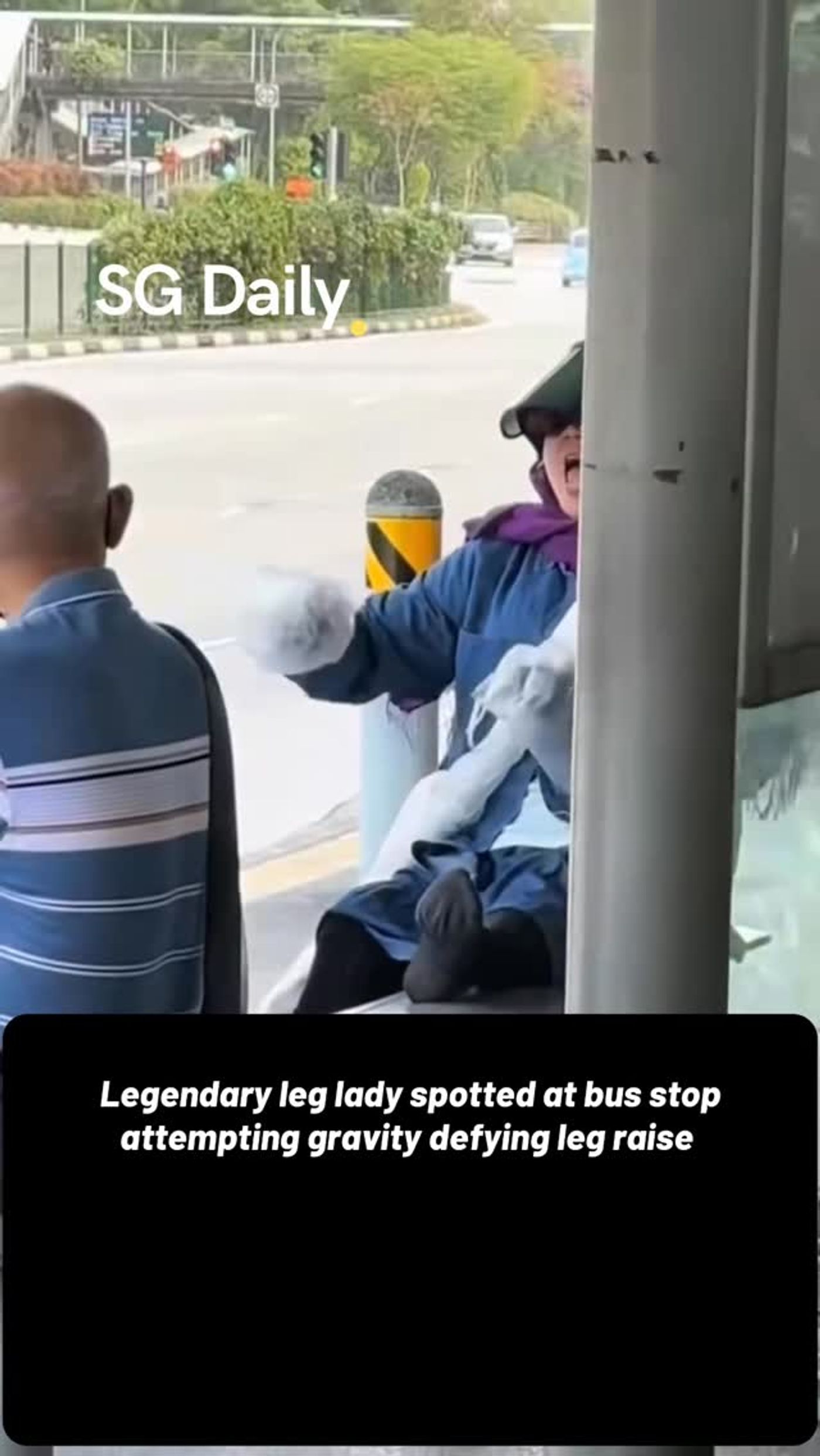 Legendary leg lady spotted at bus stop attempting gravity-defying leg raise