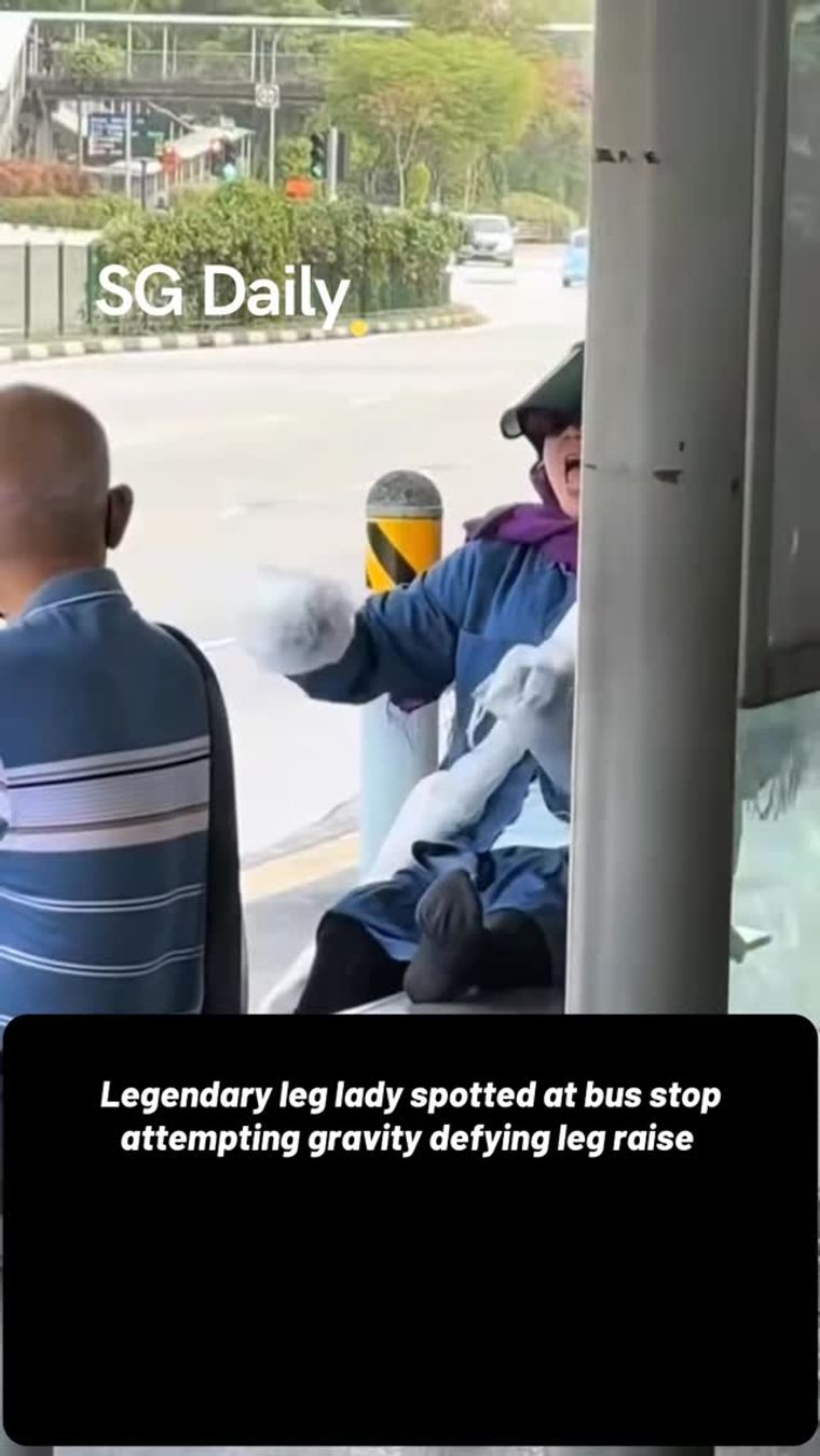 Legendary leg lady spotted at bus stop attempting gravity-defying leg raise