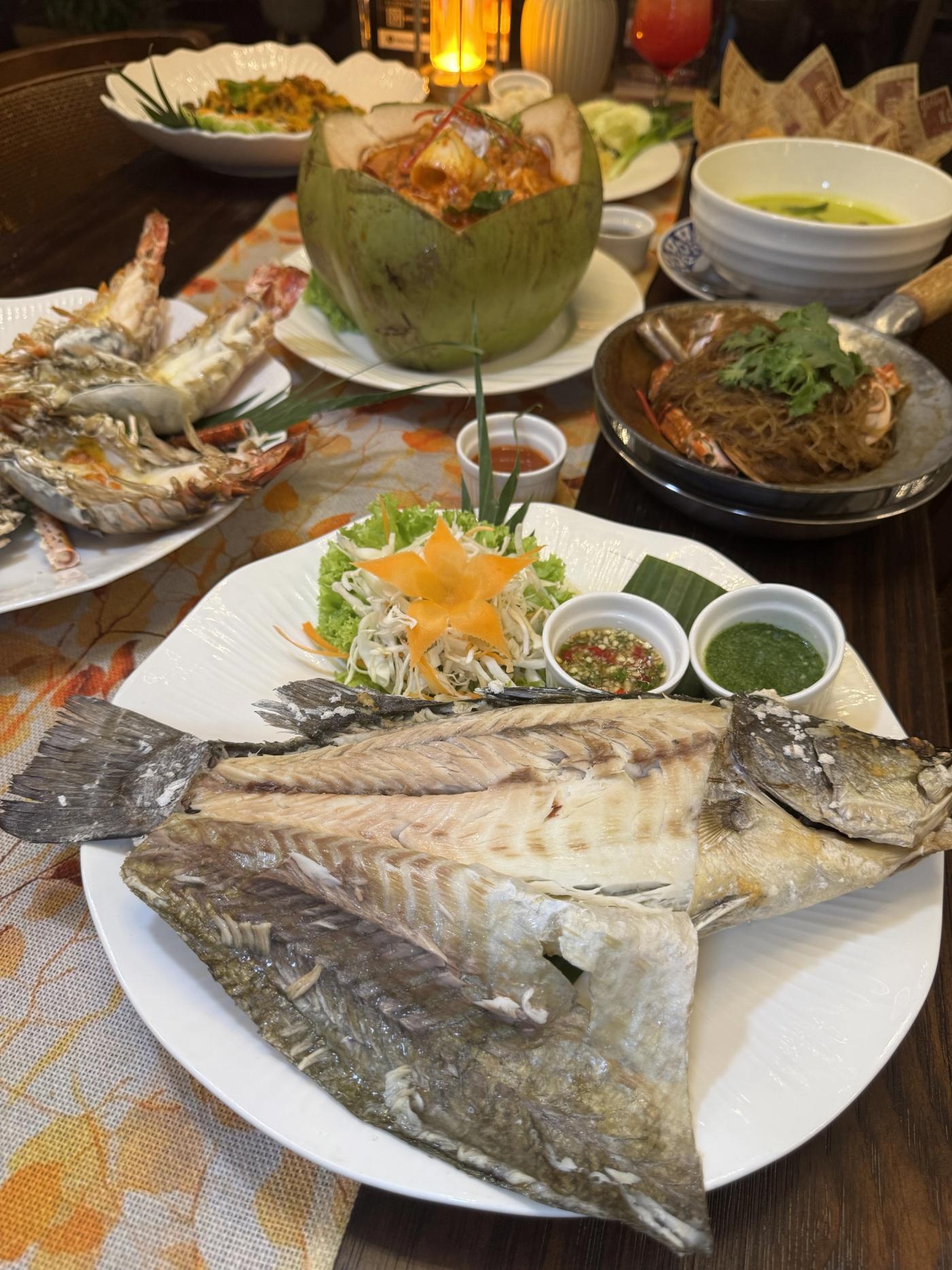 A whole fish opened flat and served with dipping sauces at Lebua Thai