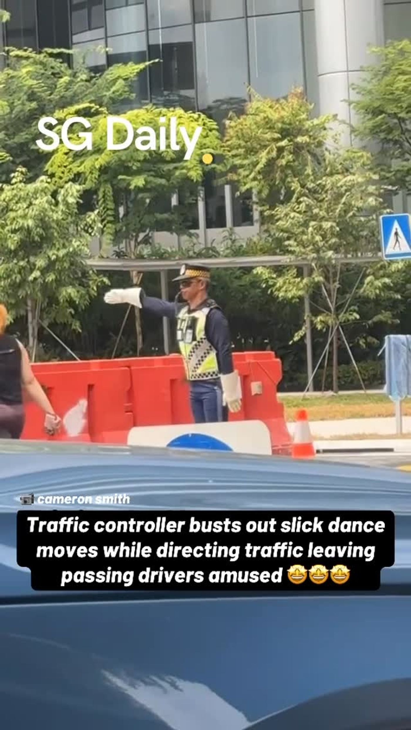 Traffic controller busts out slick dance moves while directing traffic