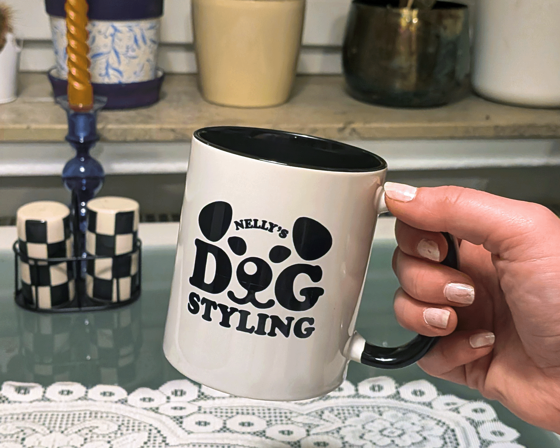 Black wordmark forming a dog's face on white, floppy ears, eyes and snout built into the chunky letters "DOG"