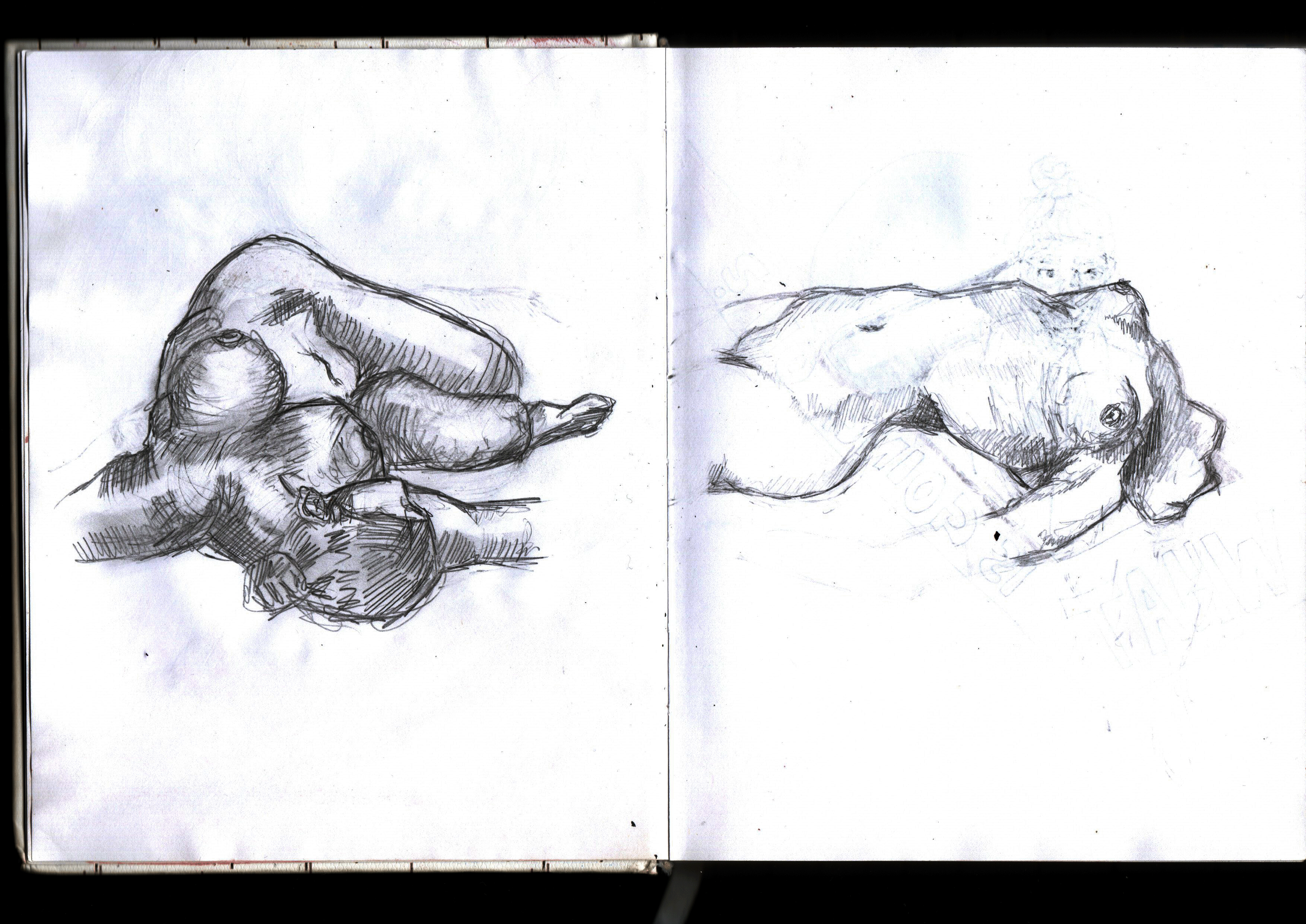 Open sketchbook spread with two pencil studies of a reclining nude figure, loose hatched shading