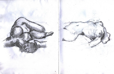 Open sketchbook spread with two pencil studies of a reclining nude figure, loose hatched shading