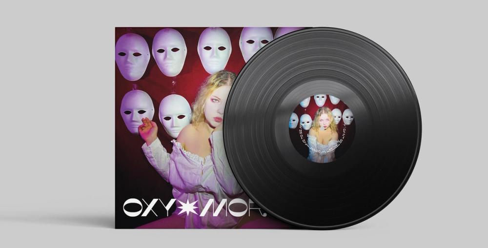 Vinyl mockup on grey: the masked cover sleeve with a black record whose picture label repeats the portrait