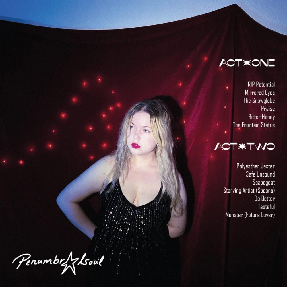 Album back cover: singer in a black sequin dress before red drapery and fairy lights, tracklist Act One and Act Two
