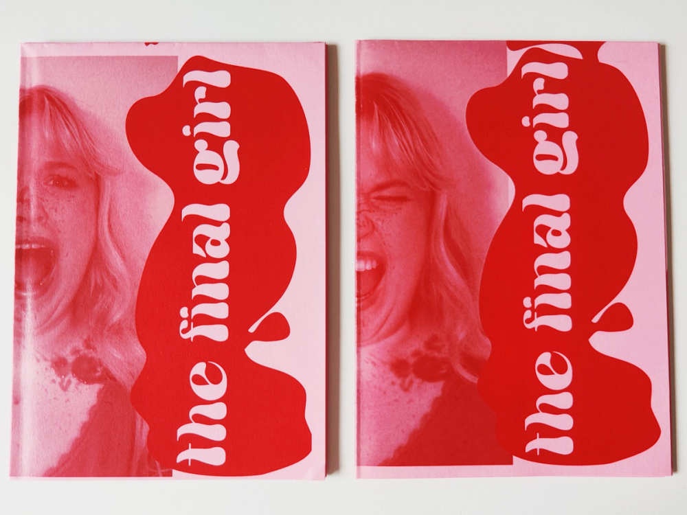 Two finished zine copies side by side, white script “the final girl” curling down a red blob over a screaming blonde