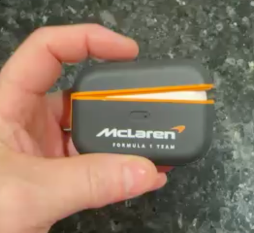 AirPods case with adhesive strip inside the lid