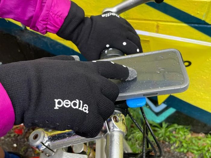Pedla AquaShield gloves used on iPhone with Quad Lock Poncho