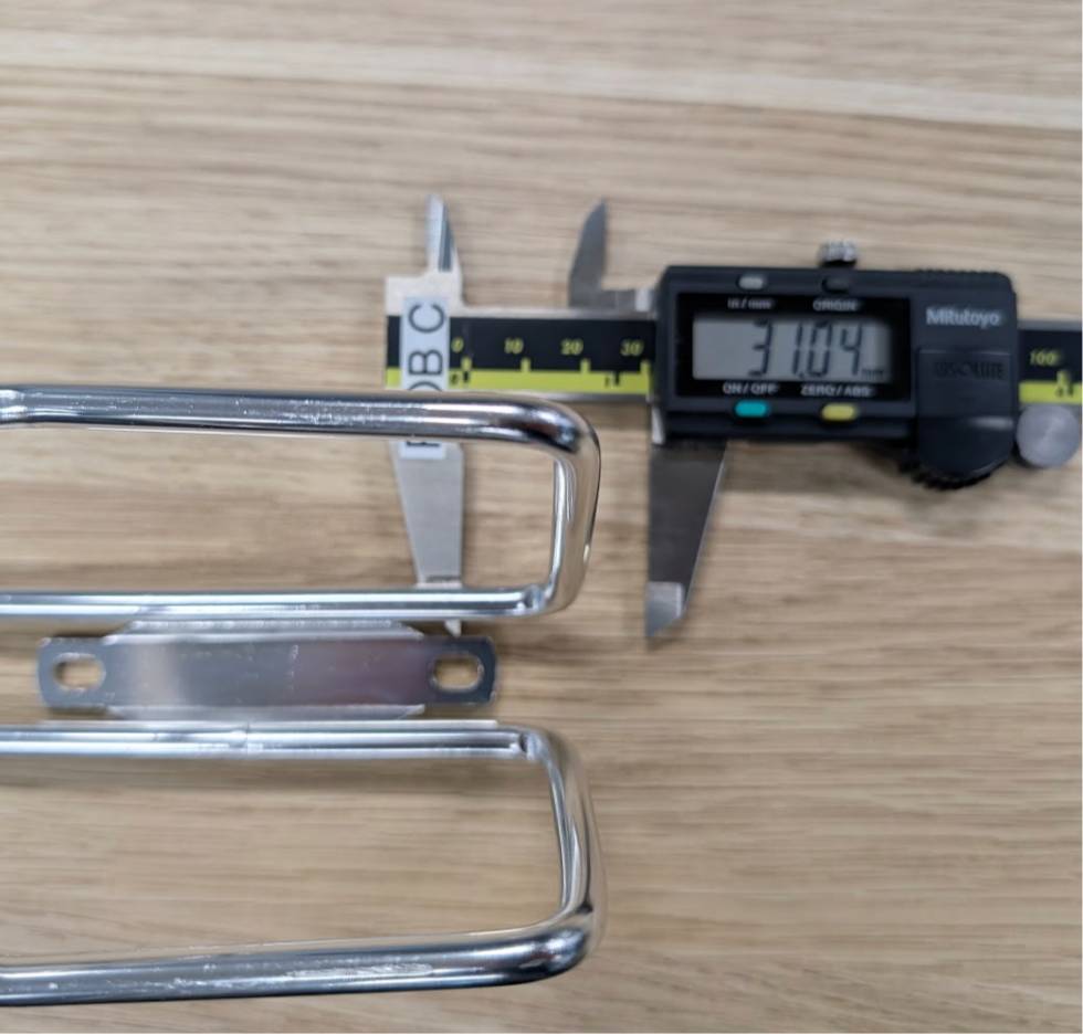 Diagram showing measurement from bottle cage base to lower mounting hole center
