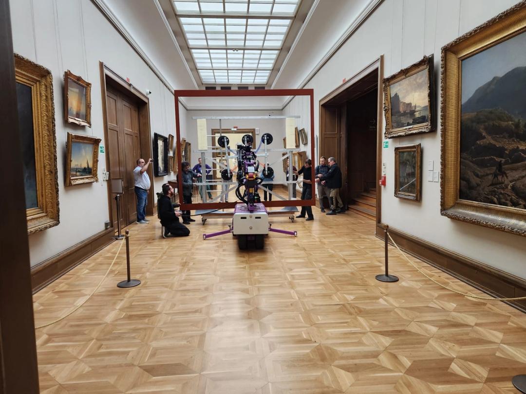 Quattrolifts glass lifter in a grand skylit museum painting gallery during a glass panel installation