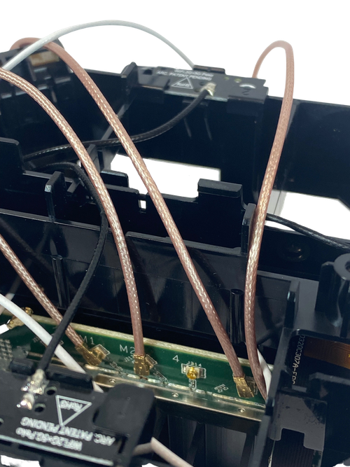 Install the U.FL-male to N-female pigtail adapters into the ports you opened up in step 10
