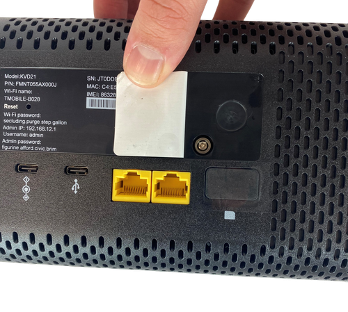 Unscrew the phillips-head screw underneath the QR-code sticker.