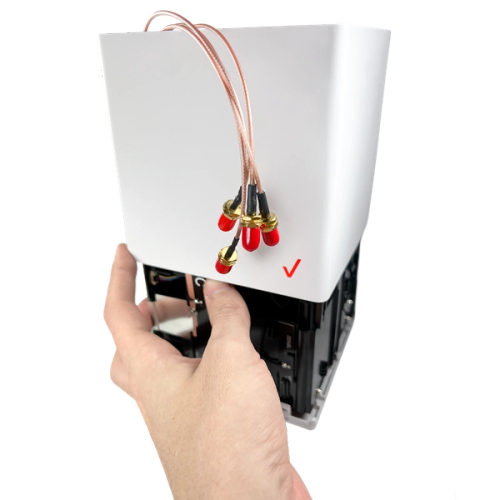Holding antenna J3 in place to slide down the outer cover.