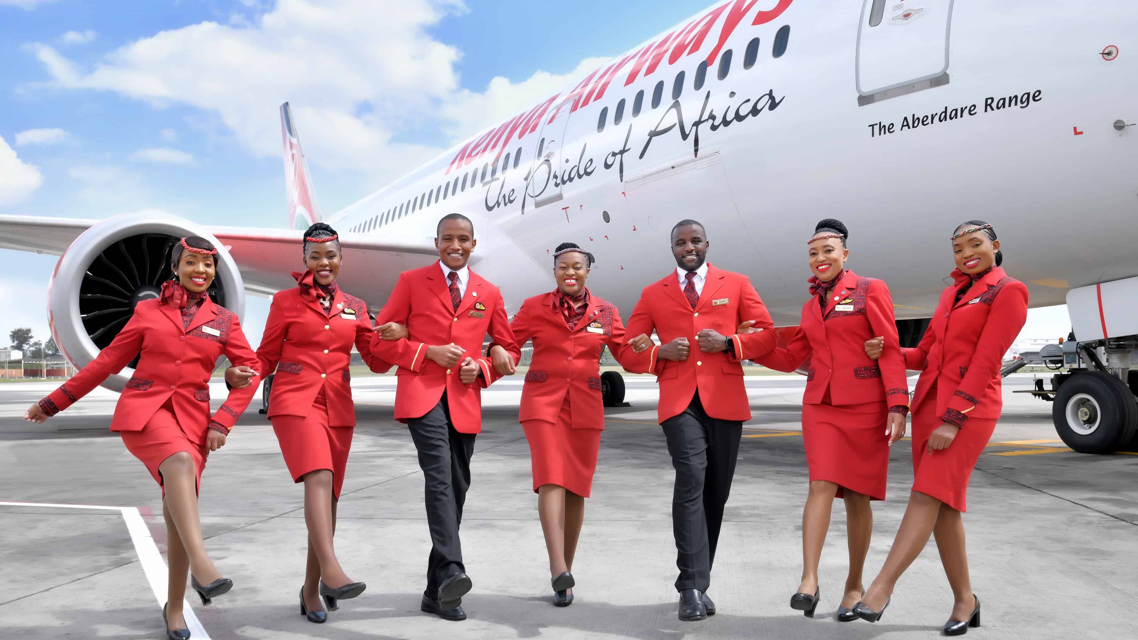Kenya Airways staff pose behind their aircraft