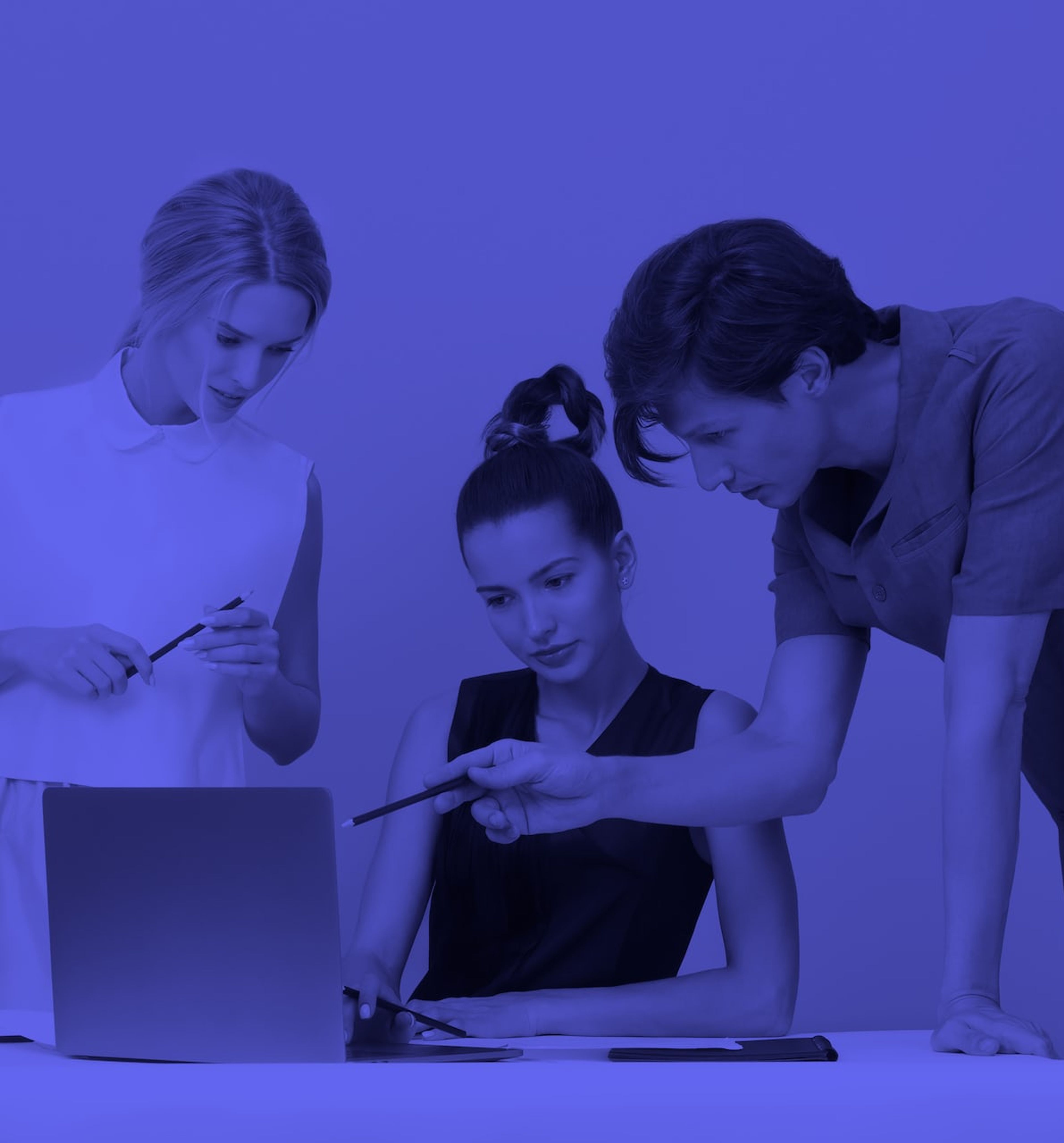 3 people looking at a single laptop